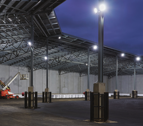 an industrial yard with bright white lights